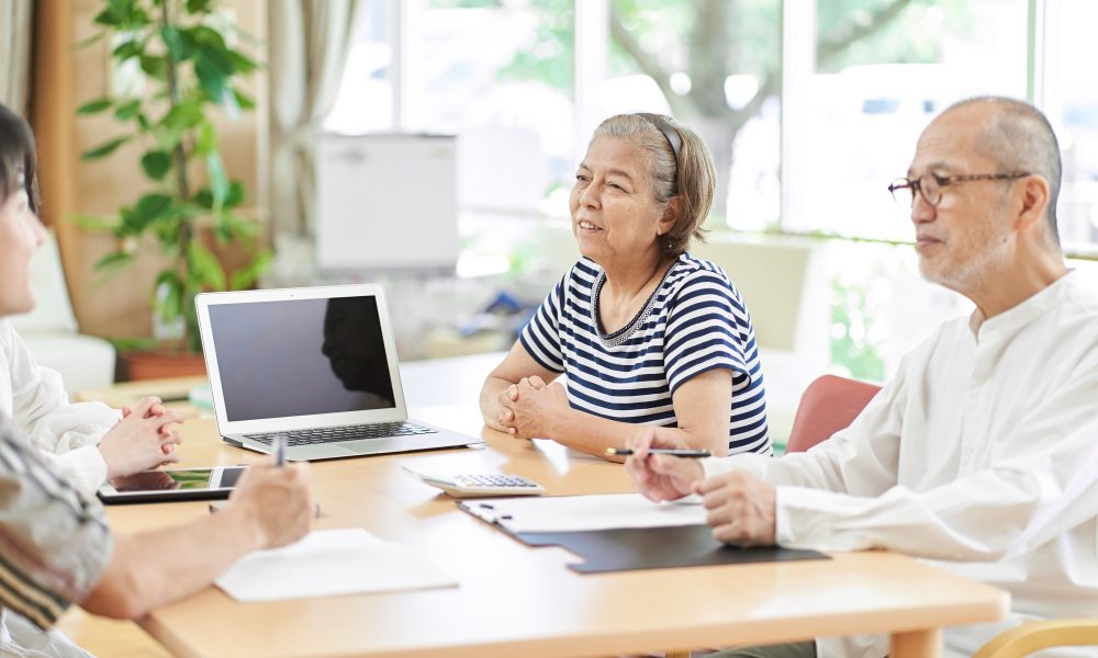 An elderly couple consulting on a life plan