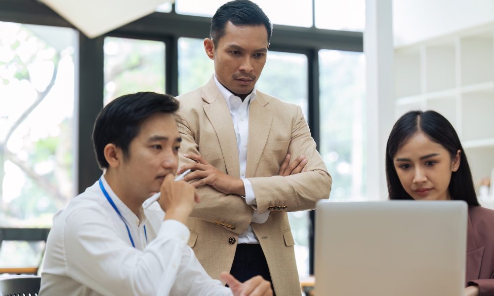 Business man advise colleague about project in office
