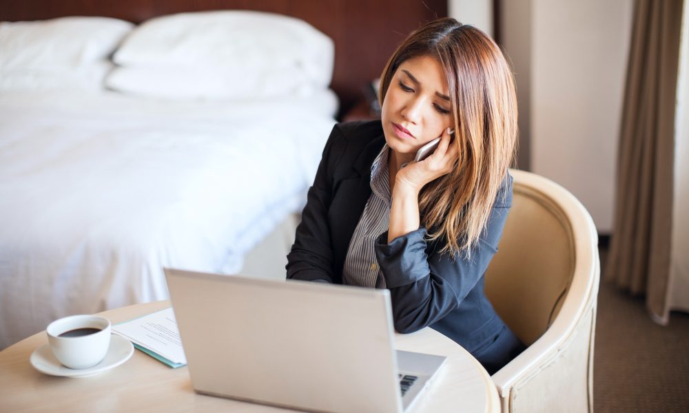 Female lawyer working in a hotel room