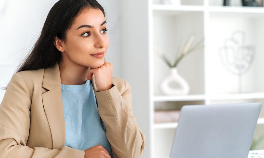 Thoughtful gorgeous successful arabian or indian business woman, company employee, corporate lawyer